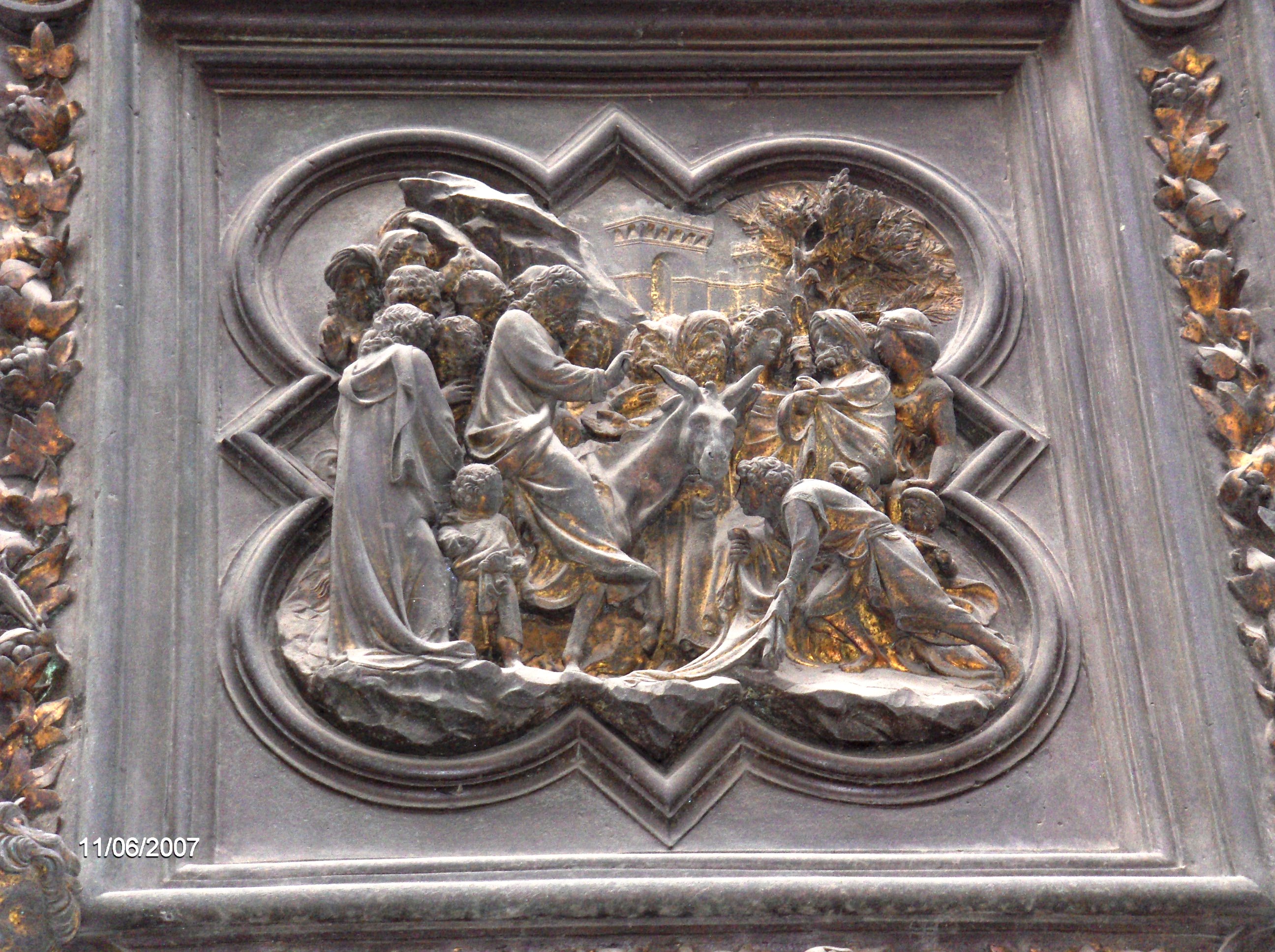 North Baptistery Door depicting Jesus arriving on a donkey