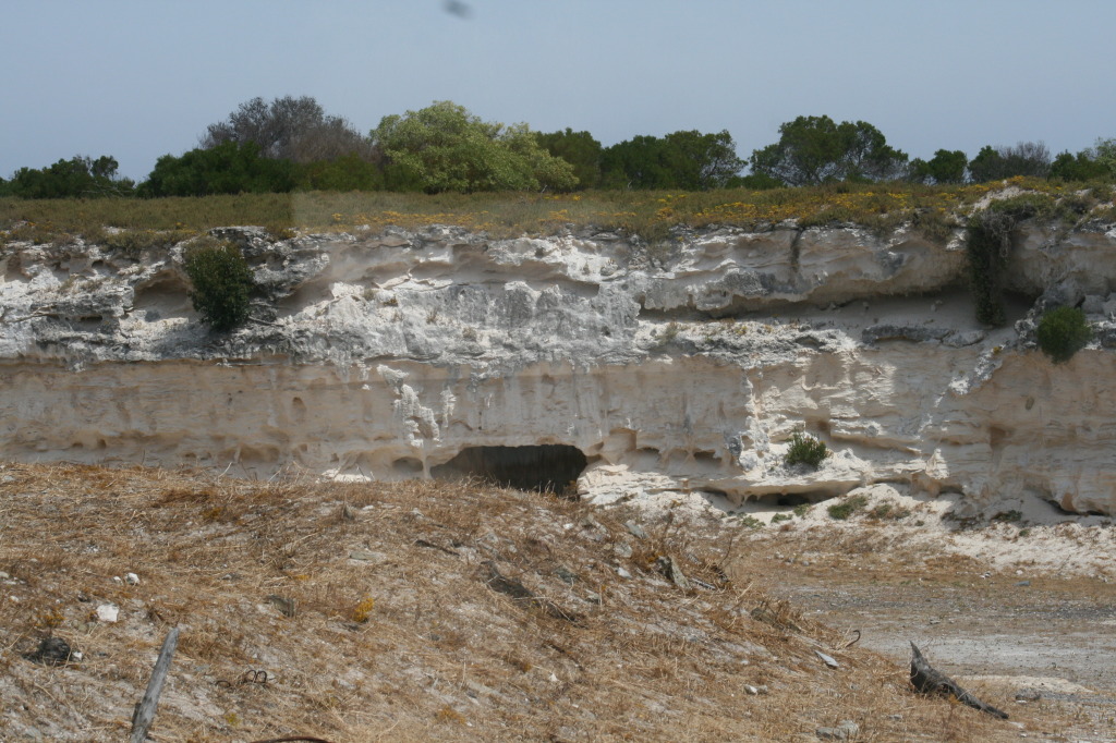 The limestone quarry with small cave to the back.