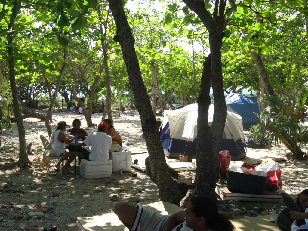 Group playing dominoes while others chill at Smith Cove beach ( close to GeorgeTown)