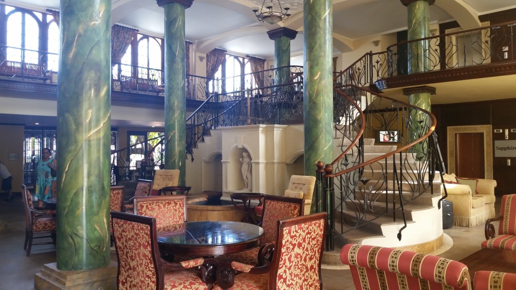 Hotel lobby at Jewels Dunn's River Resort. It has multiple entrances and exits.