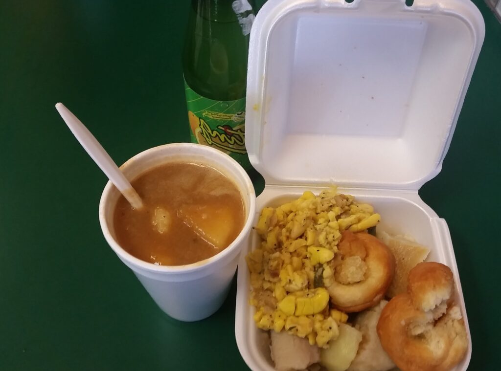 Ackee and saltfish, festival and boiled banana with red peas soup and a Ting