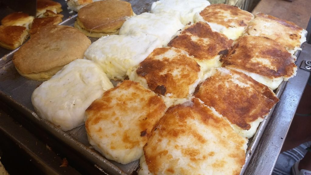 Two types of arepas brought to you courtesy pf the local street vendors