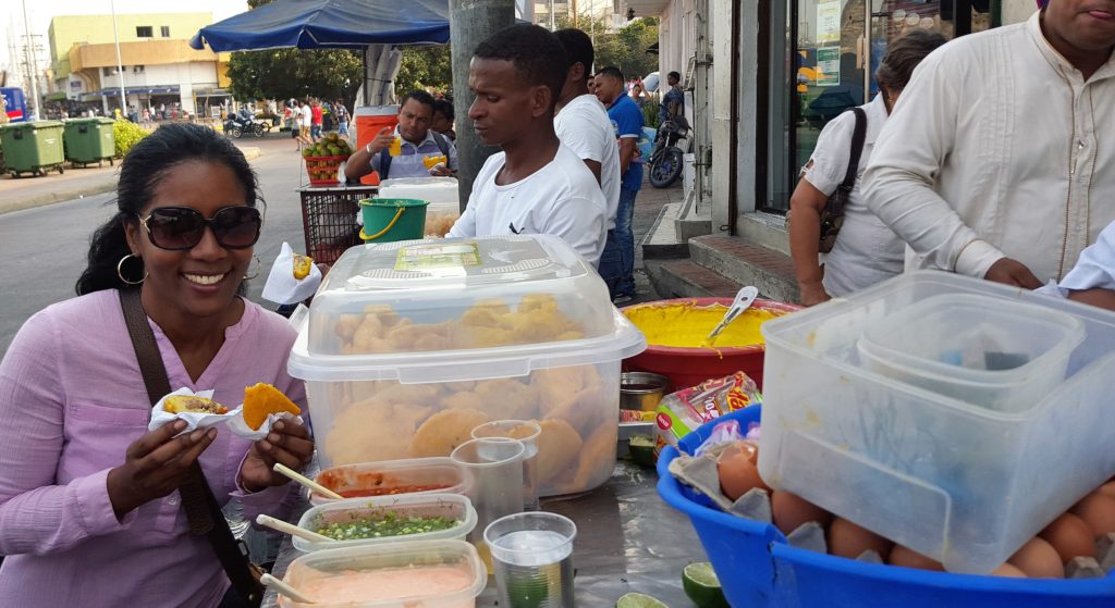 Busy stuffing my hands and face with street goodies. See all those dressings on the side?