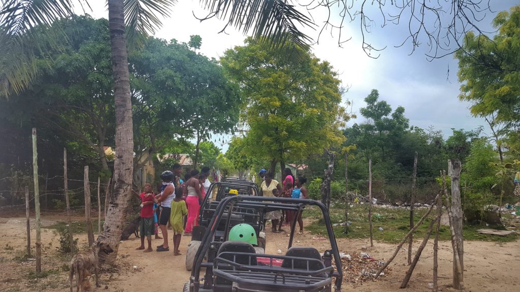 Dune buggies stop at village in La Romana Province, Dominican Republic