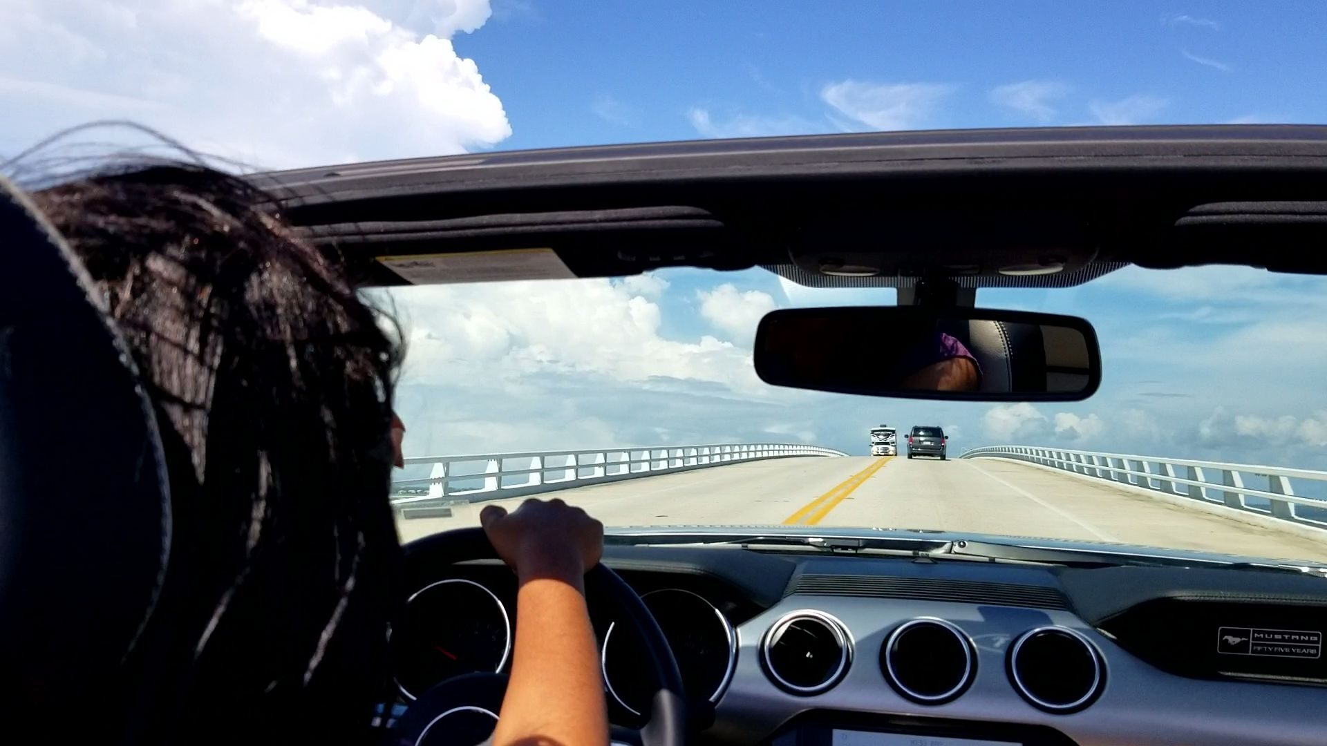 Woman in convertible going on a road trip