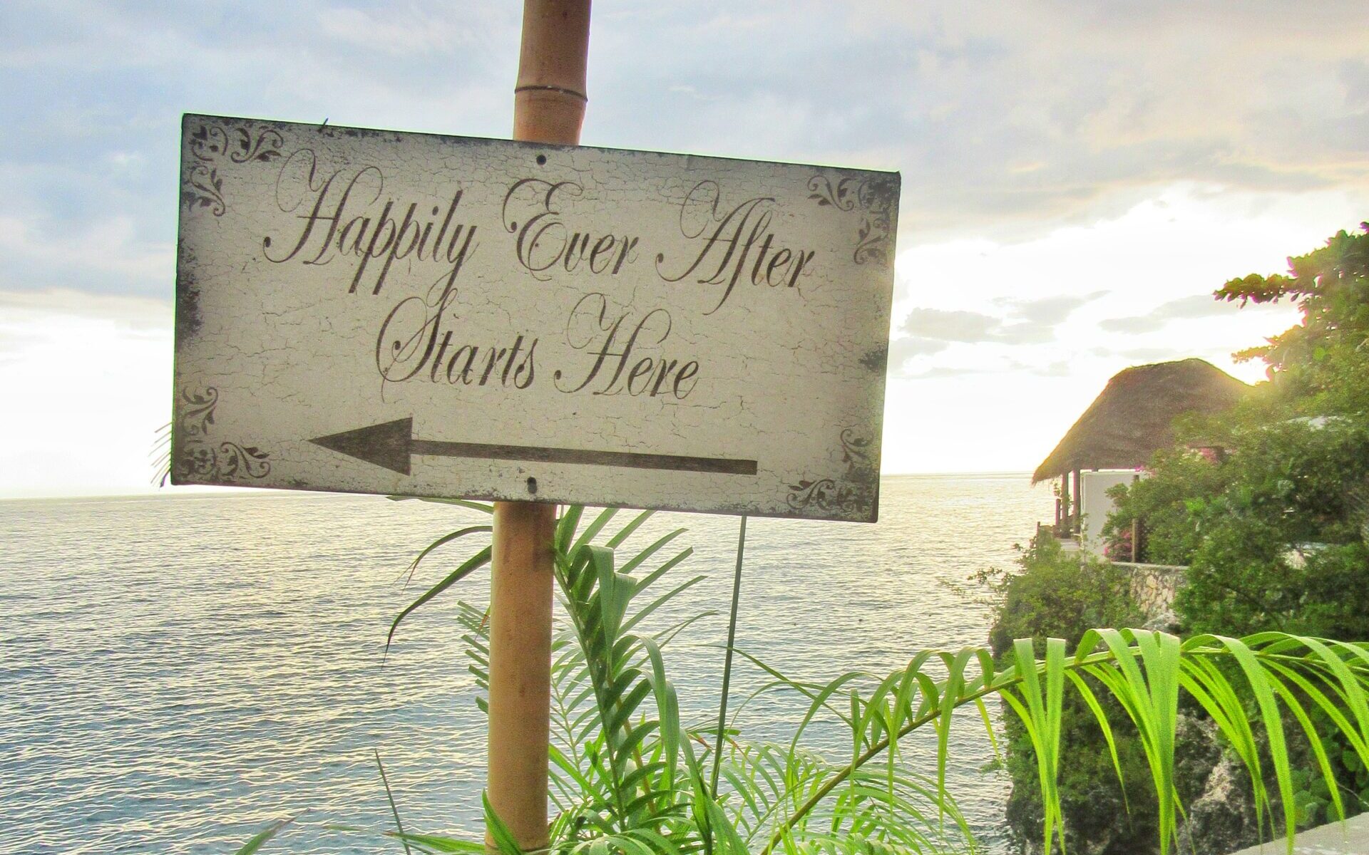Happily Ever After sign, with ocean in the background